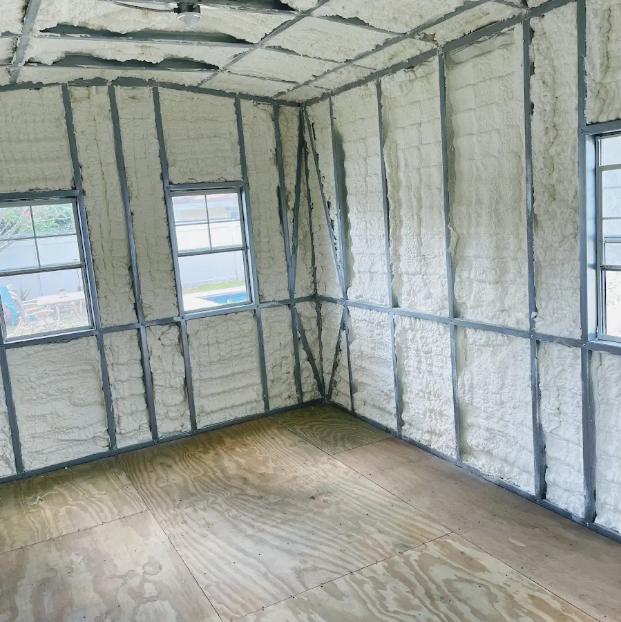 Closed-cell spray foam insulation applied to wall cavities in a residential project in Merrifield